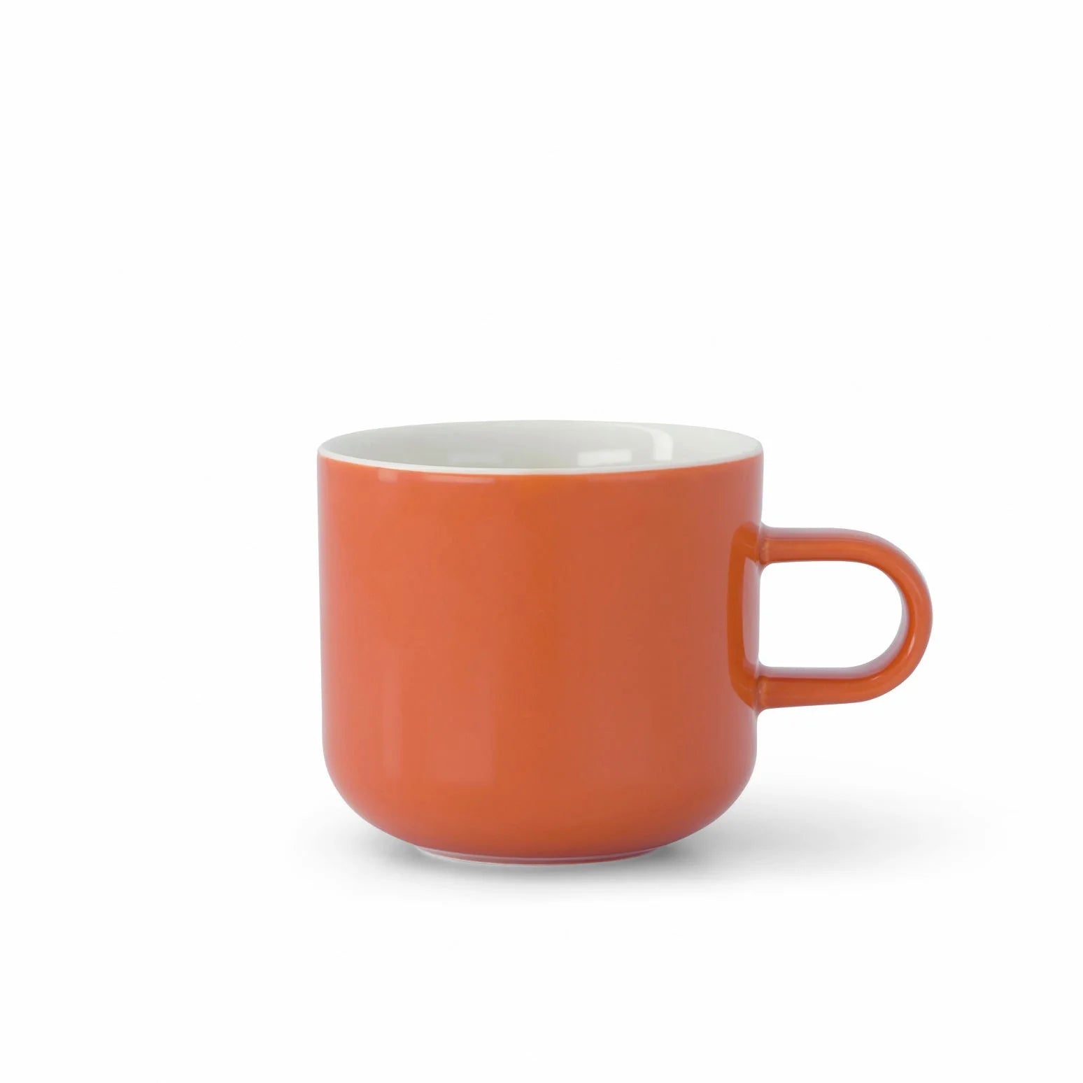 Orange mug with a white interior on a white background